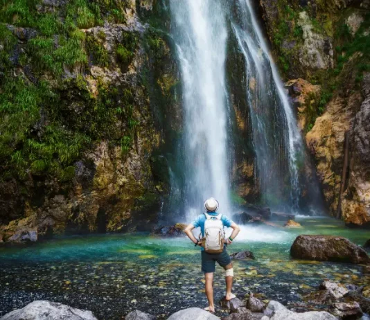 man-hat-stays-streams-waterfall-grunas-waterfall-is-picturesque-site-inside-national-park-thethi-albania